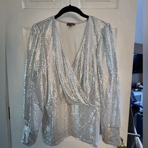 Woman’s sequined faux-wrapped long sleeve top